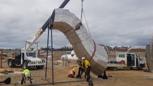 Our 20t Franna crane on hire lifting the neck section.